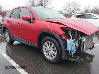2015 Mazda CX-5 Touring with VIN JM3KE4CY3F0529669, listed as a IAAI auction lot 41866873 with 137,635 mi miles and . Bid and sale history available at carsss.com. Image 1.
