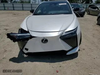 2023 Lexus RZ with VIN JTJAAAAB7PA001851, listed as a Copart auction lot 57144464 with 3,731 mi miles and Salvage Title. Bid and sale history available at carsss.com. Image 12.