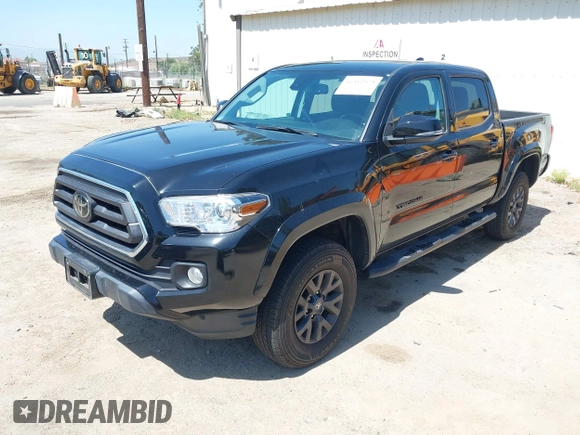 2023 Toyota Tacoma SR with VIN 3TMCZ5AN1PM654572, listed as a IAAI auction lot 42312575 with 14,111 mi miles and . Bid and sale history available at DreamBid. Image 18.