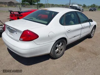 2000 Ford Taurus SES with VIN 1FAFP55U0YA264104, listed as a IAAI auction lot 42006518 with 245,838 mi miles. Bid and sale history available at carsss.com. Image 4.