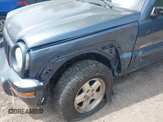 2002 Jeep Liberty Limited z VIN 1J4GL58KX2W339237, wystawiony jako IAAI lot #42284526 z przebiegiem 183 416 mil mil oraz . Historia ofert i sprzedaży dostępna na DreamBid. Obrazek 6.