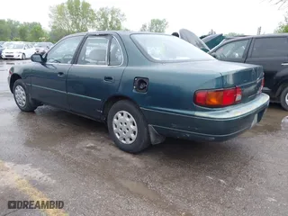 1996 Toyota Camry DX with VIN JT2BG12K5T0346311, listed as a IAAI auction lot 42130482 with 214,872 mi miles. Bid and sale history available at carsss.com. Image 3.