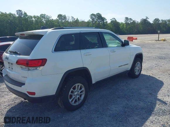 2020 Jeep Grand Cherokee Laredo E with VIN 1C4RJFAG1LC389026, listed as a IAAI auction lot 42261396 with 100,409 mi miles and . Bid and sale history available at DreamBid. Image 4.