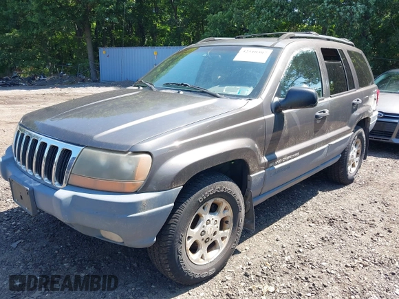 2000 Jeep Grand Cherokee Laredo with VIN 1J4GW48S8YC380039, listed as a IAAI auction lot 42510307 with 215,776 mi miles and . Bid and sale history available at DreamBid. Image 2.