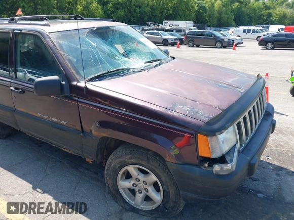 1997 Jeep Grand Cherokee Laredo with VIN 1J4GZ58S0VC708420, listed as a IAAI auction lot 42624603 with Not provided miles and . Bid and sale history available at DreamBid. Image 6.