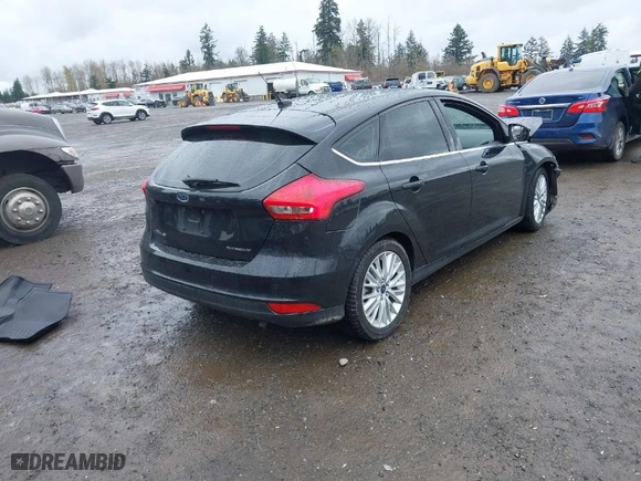 2015 Ford Focus Titanium with VIN 1FADP3N2XFL300859, listed as a IAAI auction lot 41944410 with 76,194 mi miles. Bid and sale history available at carsss.com. Image 4.