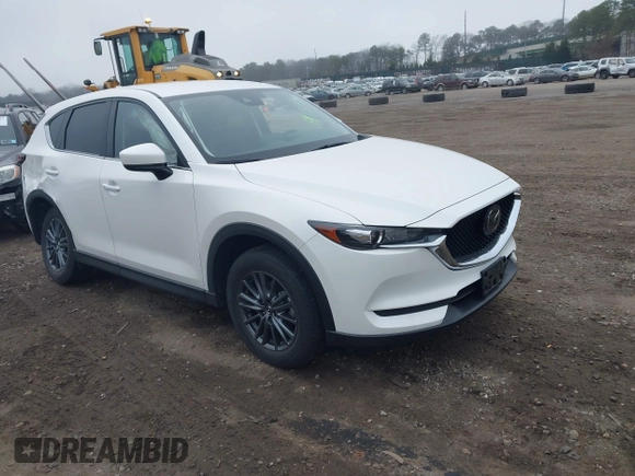2021 Mazda CX-5 Touring with VIN JM3KFBCM1M1446313, listed as a IAAI auction lot 41930330 with 28,610 mi miles. Bid and sale history available at carsss.com. Image 1.
