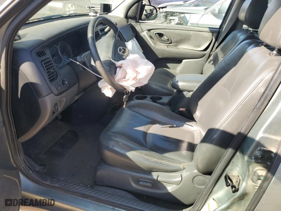 2004 Mazda Tribute ES with VIN 4F2CZ06114KM02980, listed as a Copart auction lot 77319964 with 178,922 mi miles and Salvage Title. Bid and sale history available at carsss.com. Image 7.