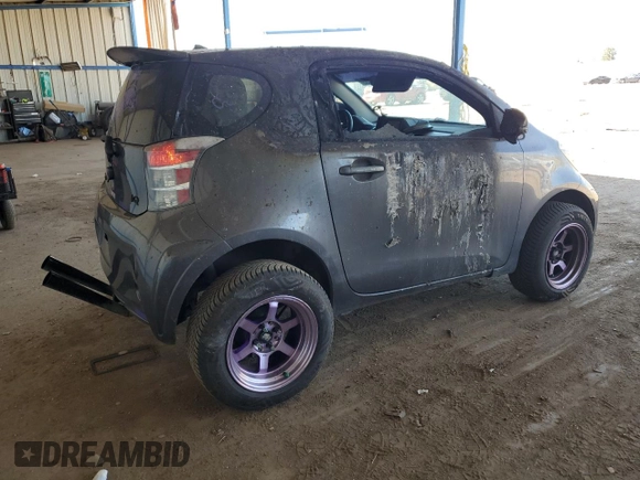 2012 Scion iQ z VIN JTNJJXB09CJ012794, wystawiony jako Copart lot #52983435 z przebiegiem 135 927 mil mil oraz Szkoda całkowita • Salvage title. Historia ofert i sprzedaży dostępna na DreamBid. Obrazek 3.