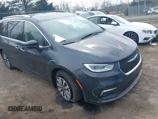 2021 Chrysler Pacifica Hybrid Touring L z VIN 2C4RC1L7XMR593987, wystawiony jako IAAI lot #41855966 z przebiegiem 72 685 mil mil oraz . Historia ofert i sprzedaży dostępna na DreamBid. Obrazek 1.