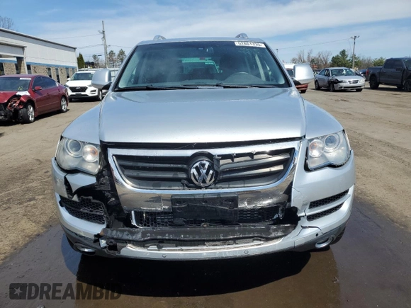 2010 Volkswagen Touareg VR6 with VIN WVGBF7A97AD004355, listed as a Copart auction lot 52861335 with 129,454 mi miles and Salvage Title. Bid and sale history available at DreamBid. Image 5.