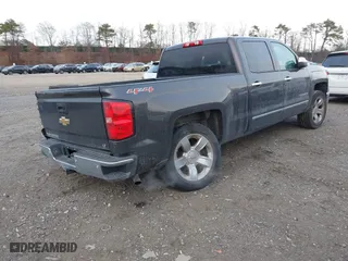 2014 Chevrolet Silverado 1500 LTZ with VIN 3GCUKSEC4EG384636, listed as a IAAI auction lot 41352484 with 153,976 mi miles. Bid and sale history available at carsss.com. Image 4.