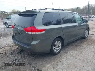 2012 Toyota Sienna XLE AAS with VIN 5TDYK3DC1CS199113, listed as a IAAI auction lot 42123757 with 211,723 mi miles and . Bid and sale history available at carsss.com. Image 4.