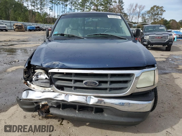 2003 Ford F-150 XL with VIN 1FTRX07273KB66549, listed as a Copart auction lot 83552004 with 205,026 mi miles and Salvage title. Bid and sale history available at DreamBid. Image 5.