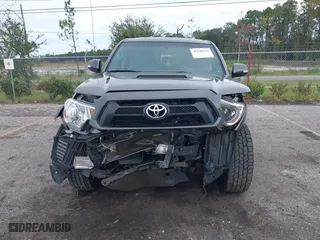 2014 Toyota Tacoma with VIN 5TFLU4EN9EX099414, listed as a IAAI auction lot 40528514 with 122,827 mi miles. Bid and sale history available at carsss.com. Image 11.
