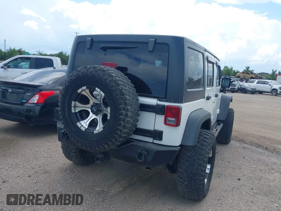 2011 Jeep Wrangler Unlimited Rubicon with VIN 1J4BA6H10BL536027, listed as a IAAI auction lot 42567901 with 164,487 mi miles and . Bid and sale history available at DreamBid. Image 4.