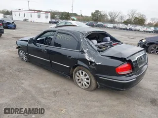 2004 Hyundai Sonata GLS with VIN KMHWF35HX4A068682, listed as a IAAI auction lot 41933856 with 127,508 mi miles. Bid and sale history available at carsss.com. Image 3.