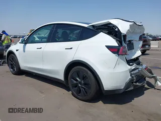 2024 Tesla Model Y with VIN 7SAYGDED8RF201955, listed as a IAAI auction lot 42700483 with 11,898 mi miles and . Bid and sale history available at DreamBid. Image 3.