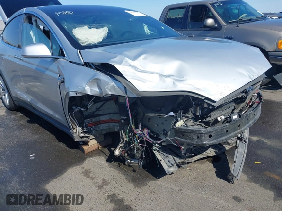 2016 Tesla Model X 70D with VIN 5YJXCAE21GF033123, listed as a IAAI auction lot 39813497 with 162,509 mi miles and . Bid and sale history available at DreamBid. Image 6.