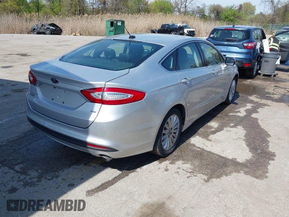 2016 Ford Fusion Energi SE Luxury with VIN 3FA6P0PU8GR273122, listed as a IAAI auction lot 42062083 with 166,318 mi miles. Bid and sale history available at carsss.com. Image 4.