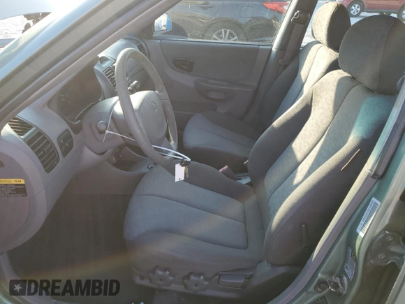 2005 Hyundai Accent GLS with VIN KMHCG45C35U595666, listed as a Copart auction lot 88294365 with 70,497 mi miles and Salvage Title. Bid and sale history available at carsss.com. Image 7.