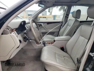 2000 Mercedes-Benz E-Class with VIN WDBJF65J5YB068297, listed as a Copart auction lot 69199004 with 236,751 mi miles and Salvage Title. Bid and sale history available at carsss.com. Image 7.