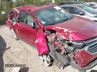 2021 Chevrolet Equinox Premier z VIN 2GNAXNEV7M6140889, wystawiony jako IAAI lot #42039443 z przebiegiem 101 767 mil mil oraz . Historia ofert i sprzedaży dostępna na DreamBid. Obrazek 6.