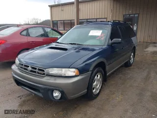 1997 Subaru Legacy Wagon Outback with VIN 4S3BG6854V7613017, listed as a IAAI auction lot 41574832 with 294,964 mi miles. Bid and sale history available at carsss.com. Image 2.