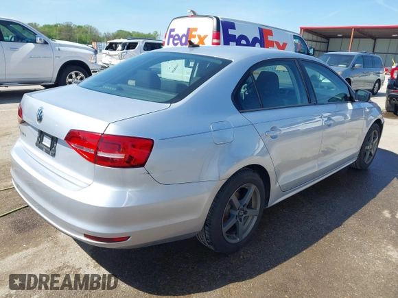 2015 Volkswagen Jetta Sedan 2.0L S with VIN 3VW2K7AJXFM423061, listed as a IAAI auction lot 42083522 with 161,028 mi miles. Bid and sale history available at carsss.com. Image 4.