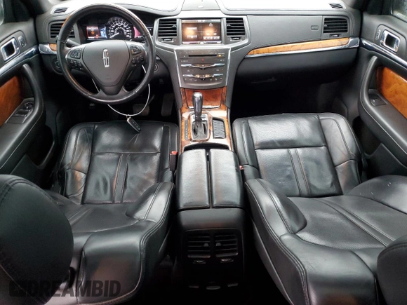 2014 Lincoln MKS EcoBoost с VIN 1LNHL9FT7EG601089, выставлен на аукционе Copart как лот 49483605 с пробегом 121 709 миль миль и Списание • Salvage title. История ставок и продаж доступна на DreamBid. Изображение 8.