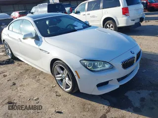 2015 BMW 6 Series 640i xDrive with VIN WBA6B8C50FD453317, listed as a IAAI auction lot 41635430 with 77,811 mi miles and . Bid and sale history available at carsss.com. Image 1.