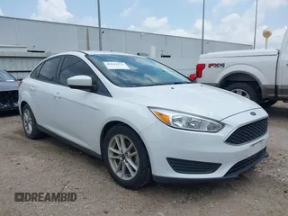 2018 Ford Focus SE z VIN 1FADP3F22JL292697, wystawiony jako IAAI lot #42094271 z przebiegiem 43 614 mil mil oraz . Historia ofert i sprzedaży dostępna na DreamBid. Obrazek 1.