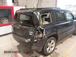 2014 Jeep Patriot Latitude with VIN 1C4NJPFA0ED633657, listed as a IAAI auction lot 41447982 with 104,664 mi miles and . Bid and sale history available at carsss.com. Image 6.