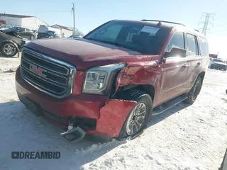 2015 GMC Yukon SLE with VIN 1GKS2AKC2FR514005, listed as a IAAI auction lot 41292783 with 129,413 mi miles. Bid and sale history available at carsss.com. Image 2.