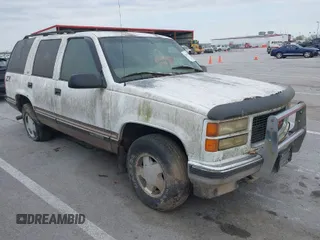 1997 GMC Yukon with VIN 1GKEK13R2VJ739795, listed as a IAAI auction lot 42011678 with 185,306 mi miles. Bid and sale history available at carsss.com. Image 1.
