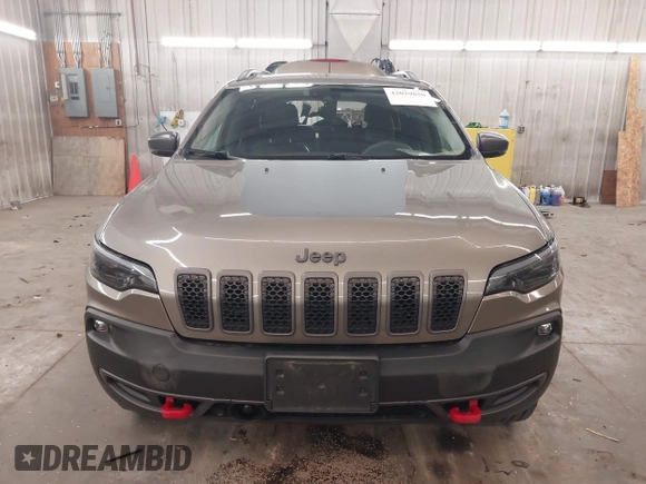2021 Jeep Cherokee Trailhawk z VIN 1C4PJMBX5MD231018, wystawiony jako IAAI lot #42029850 z przebiegiem 66 525 mil mil oraz . Historia ofert i sprzedaży dostępna na DreamBid. Obrazek 13.