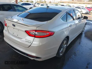 2016 Ford Fusion Titanium Hybrid with VIN 3FA6P0RU1GR191813, listed as a IAAI auction lot 41560954 with 86,922 mi miles. Bid and sale history available at carsss.com. Image 4.