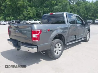 2018 Ford F-150 XL with VIN 1FTEW1E57JFA95086, listed as a IAAI auction lot 42574704 with 77,301 mi miles and . Bid and sale history available at DreamBid. Image 4.