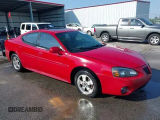 2006 Pontiac Grand Prix with VIN 2G2WP552561248999, listed as a IAAI auction lot 42000909 with 141,584 mi miles. Bid and sale history available at carsss.com. Image 1.