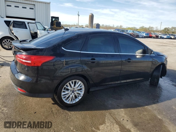 2016 Ford Focus Titanium with VIN 1FADP3J22GL201721, listed as a Copart auction lot 50633795 with 29,801 mi miles and Salvage title. Bid and sale history available at DreamBid. Image 3.