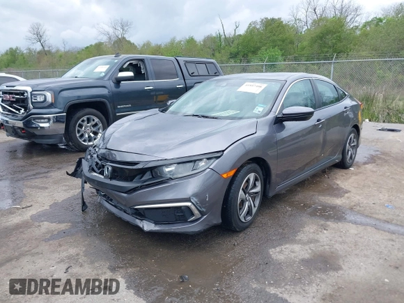 2019 Honda Civic LX with VIN 19XFC2F68KE007409, listed as a IAAI auction lot 41887406 with 57,147 mi miles and . Bid and sale history available at DreamBid. Image 2.