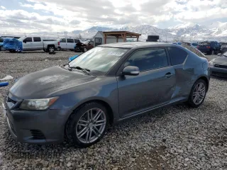 2012 Scion tC with VIN JTKJF5C74C3033572, listed as a Copart auction lot 49719195 with 127,320 mi miles and Salvage Title. Bid and sale history available at carsss.com. Image 1.