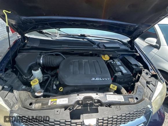 2014 Dodge Grand Caravan SXT with VIN 2C4RDGCG1ER308403, listed as a Copart auction lot 56712885 with 131,847 mi miles and Clean Title. Bid and sale history available at DreamBid. Image 7.