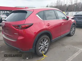 2020 Mazda CX-5 Grand Touring with VIN JM3KFADMXL0842026, listed as a IAAI auction lot 41477339 with 60,755 mi miles. Bid and sale history available at carsss.com. Image 4.