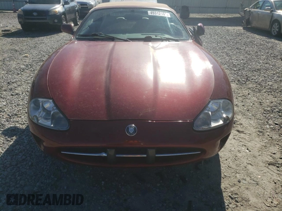 1999 Jaguar XK z VIN SAJGX2043XC032962, wystawiony jako Copart lot #49312155 z przebiegiem 74 662 mil mil oraz Szkoda całkowita • Salvage title. Historia ofert i sprzedaży dostępna na DreamBid. Obrazek 5.