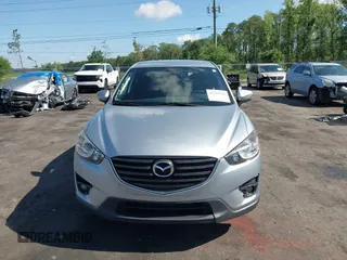 2016 Mazda CX-5 Touring z VIN JM3KE4CY4G0646114, wystawiony jako IAAI lot #42269181 z przebiegiem 58 252 mil mil oraz . Historia ofert i sprzedaży dostępna na DreamBid. Obrazek 13.