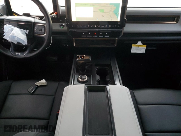 2024 GMC Hummer EV 2X z VIN 1GKB0NDE4RU104402, wystawiony jako Copart lot #50191545 z przebiegiem 15 506 mil mil oraz Szkoda całkowita • Salvage title. Historia ofert i sprzedaży dostępna na DreamBid. Obrazek 8.