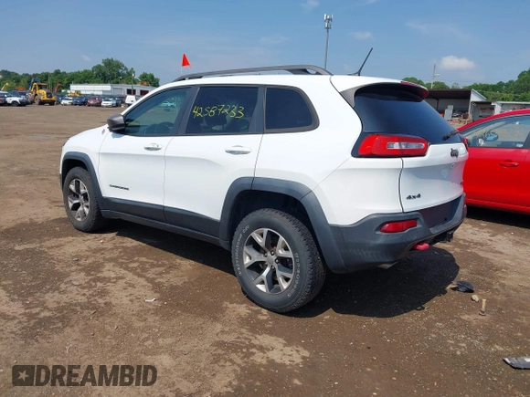 2014 Jeep Cherokee Trailhawk z VIN 1C4PJMBS0EW188976, wystawiony jako IAAI lot #42587233 z przebiegiem 191 670 mil mil oraz . Historia ofert i sprzedaży dostępna na DreamBid. Obrazek 3.