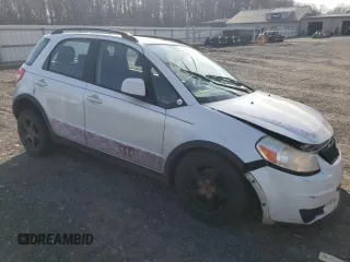 2012 Suzuki SX4 Crossover with VIN JS2YB5A32C6303887, listed as a Copart auction lot 82214144 with 0 mi miles and Salvage Title. Bid and sale history available at carsss.com. Image 4.