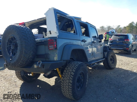 2014 Jeep Wrangler Unlimited Rubicon with VIN 1C4BJWFG3EL248164, listed as a IAAI auction lot 41290490 with 116,383 mi miles. Bid and sale history available at carsss.com. Image 4.